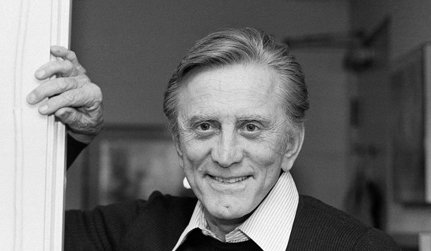 This Nov. 16, 1982 file photo shows actor Kirk Douglas at his home in Beverly Hills, Calif. Douglas died Wednesday, Feb. 5, 2020, at age 103. (AP Photo/Wally Fong, File)