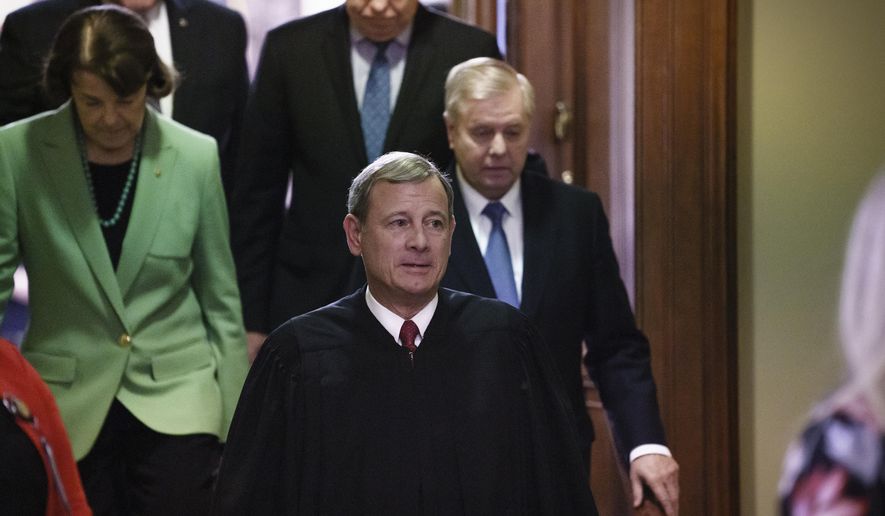 Chief Justice of the United States John Roberts, followed by Sen. Dianne Feinstein, D-Calif., left, and Senate Judiciary Committee Chairman Lindsey Graham, R-S.C., leaves the Senate chamber after presiding over the impeachment trial and today&#x27;s acquittal of President Donald Trump, at the Capitol in Washington, Wednesday, Feb. 5, 2020. (AP Photo/J. Scott Applewhite)