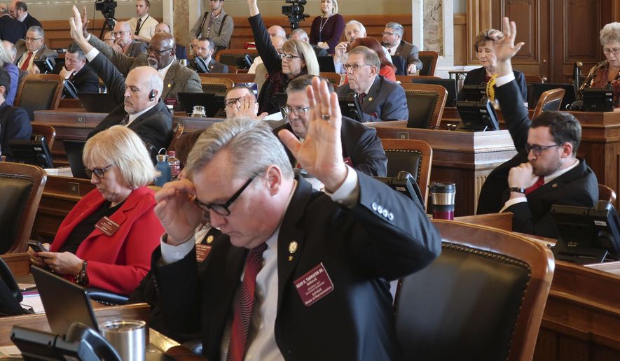 Republicans in the Kansas House indicate that they want a roll call vote on giving first-round approval to a proposed amendment to the state constitution on abortion, Thursday, Feb. 6, 2020, at the Statehouse in Topeka, Kan. The amendment would overturn a Kansas Supreme Court decision protecting abortion rights and has advanced to a final vote. (AP Photo/John Hanna)