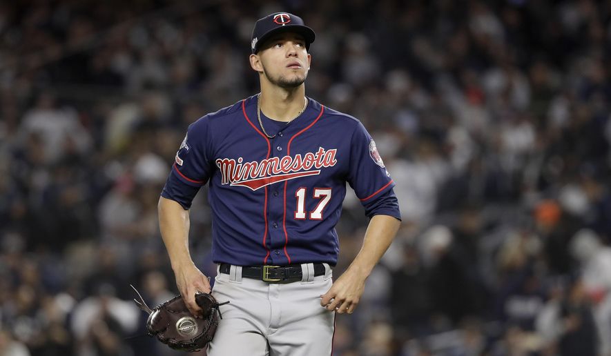 FILE - In this Oct. 4, 2019, file photo, Minnesota Twins starting pitcher Jose Berrios (17) reacts as he walks off the field at the end of the third inning against the New York Yankees during Game 1 of an American League Division Series baseball game in New York. The Twins beat Berríos in salary arbitration giving teams a 2-0 record in hearings this year. Berríos will be paid $4,025,000 rather than his request for $4.4 million. The decision was made Thursday, Feb. 6, 2020, by Frederic Horowitz, Andrew Strongin and Margaret Brogan, who heard the case a day earlier. (AP Photo/Frank Franklin II, File)
