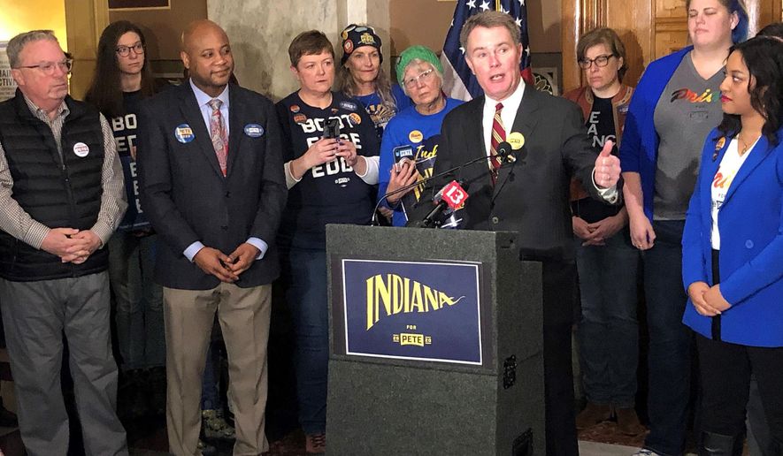 Indianapolis Mayor Joe Hogsett speaks just before filing paperwork to place former South Bend, Indiana, Mayor Pete Buttigieg's name on the Indiana Democratic presidential primary ballot Thursday, Feb. 6, 2020, at the Indiana Statehouse in Indianapolis. (AP Photo/Tom Davies)