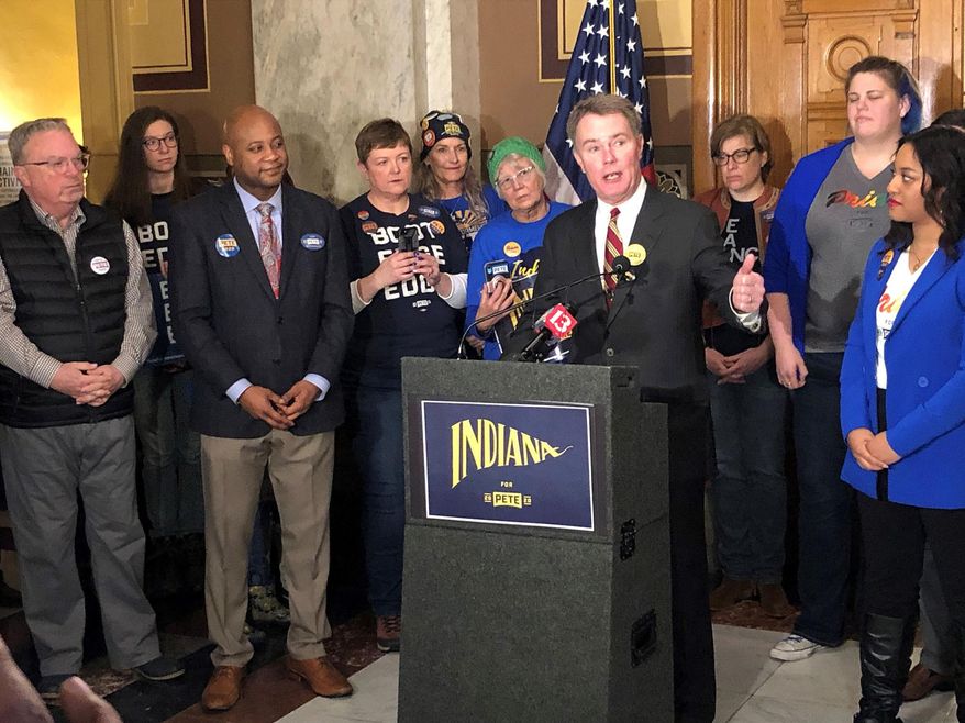 Indianapolis Mayor Joe Hogsett speaks just before filing paperwork to place former South Bend, Indiana, Mayor Pete Buttigieg's name on the Indiana Democratic presidential primary ballot Thursday, Feb. 6, 2020, at the Indiana Statehouse in Indianapolis. (AP Photo/Tom Davies)