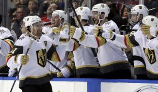Vegas Golden Knights right wing Mark Stone (61) is congratulated after scoring a goal during the second period of an NHL hockey game against the Florida Panthers, Thursday, Feb. 6, 2020, in Sunrise, Fla. (AP Photo/Lynne Sladky)