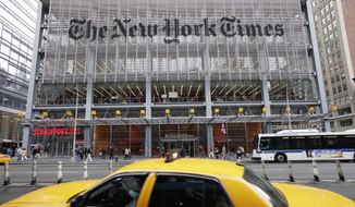In this Oct. 20, 2011, file photo, traffic passes the New York Times building in New York. (AP Photo/Mark Lennihan, File)