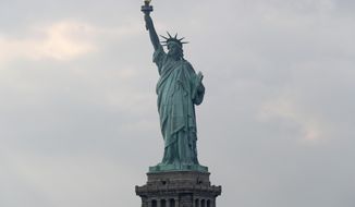 In this Aug. 14, 2019 file photo, The Statue of Liberty is shown in New York. The Department of Homeland Security says New York residents will be cut off from ‘trusted traveler’ programs because of a state law that prevents immigration officials from accessing motor vehicle records. Acting Deputy DHS Secretary Ken Cuccinelli says tens of thousands of New Yorkers will be inconvenienced by the action.  (AP Photo/Kathy Willens)