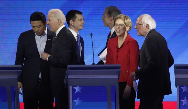 From left, Democratic presidential candidates entrepreneur Andrew Yang, former Vice President Joe Biden, former South Bend, Ind., Mayor Pete Buttigieg, businessman Tom Steyer, Sen. Elizabeth Warren, D-Mass., and Sen. Bernie Sanders, I-Vt., depart the stage after a Democratic presidential primary debate, Friday, Feb. 7, 2020, hosted by ABC News, Apple News, and WMUR-TV at Saint Anselm College in Manchester, N.H. (AP Photo/Elise Amendola)