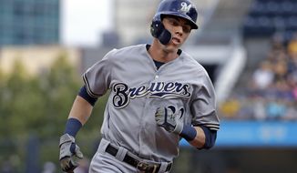 FILE - In this Monday, Aug. 5, 2019 file photo, Milwaukee Brewers&#39; Christian Yelich rounds third after hitting a solo home run off Pittsburgh Pirates starting pitcher Dario Agrazal during the first inning of a baseball game in Pittsburgh. The Milwaukee Brewers have a lot of work to do in spring training. Having Christian Yelich sure helps. Yelich was working on a strong case for his second straight NL MVP award last year when he broke his right kneecap in September, sidelining the All-Star slugger for the rest of the season. (AP Photo/Gene J. Puskar, File)