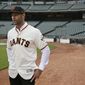 FILE - In this Nov. 13, 2019, file photo, San Francisco Giants manager Gabe Kapler stands on the field and looks out at Oracle Park in San Francisco after being introduced. Kapler knew from the get-go when named San Francisco&#39;s new manager the pressure he would feel taking over as leader of a franchise that has had so many good ones in recent memory. (AP Photo/Eric Risberg, File)