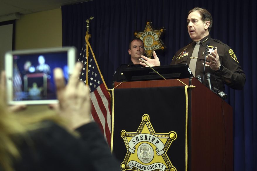 FILE - In this Feb. 1, 2018, file photo, Oakland County Sheriff Mike Bouchard speaks during a news conference in Pontiac, Mich. A man driving what appeared to be a police car didn't fool a suspicious sheriff in suburban Detroit. Bouchard said he was driving away from a meeting Thursday, Feb. 7, 2020, when he spotted a vehicle with police-style bumpers, an array of lights on the back and a decal that read "emergency response." Bouchard activated his emergency lights and stopped the vehicle. He said there was a fake radar on the dashboard and a police-style computer. He also discovered a loaded gun and a large knife. (Max Ortiz/Detroit News via AP File)