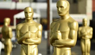 Oscar statues stand off of Hollywood Boulevard in preparation for Sunday&#39;s 92nd Academy Awards at the Dolby Theatre, Wednesday, Feb. 5, 2020, in Los Angeles. (AP Photo/Chris Pizzello)