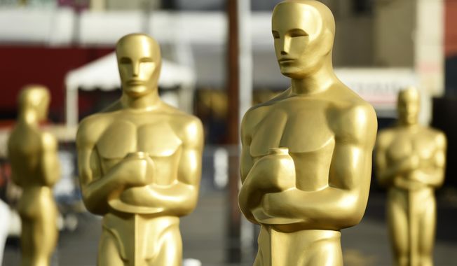 Oscar statues stand off of Hollywood Boulevard in preparation for Sunday&#x27;s 92nd Academy Awards at the Dolby Theatre, Wednesday, Feb. 5, 2020, in Los Angeles. (AP Photo/Chris Pizzello)