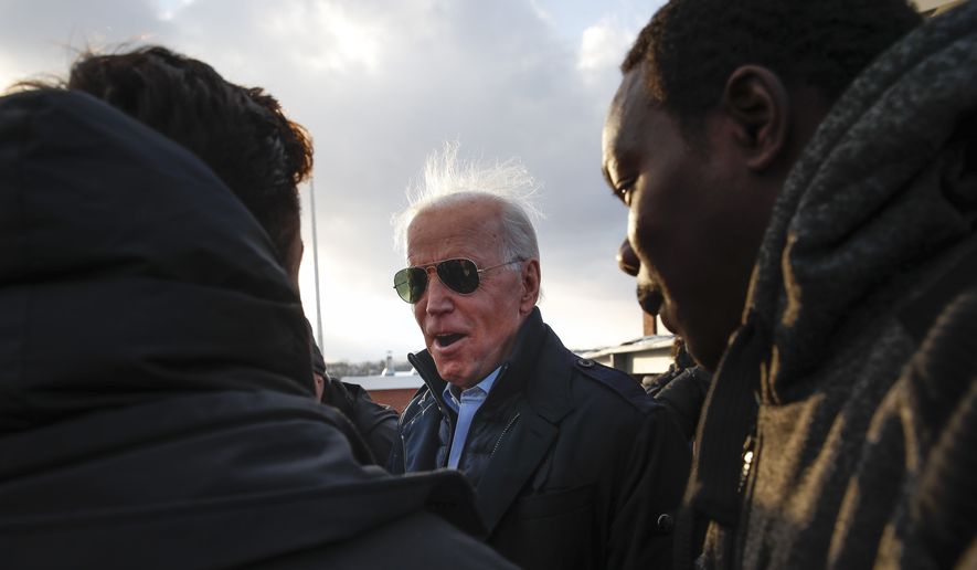Democratic presidential candidate former Vice President Joe Biden speaks with a supporters outside the Biden for President Manchester Field Office, Saturday, Feb. 8, 2020 in Manchester, N.H. (AP Photo/Pablo Martinez Monsivais)