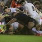 England&#39;s Ellis Genge, bottom left, scores a try in Storm Ciara during the Six Nations rugby union international match between Scotland and England at Murrayfield Stadium, in Edinburgh, Scotland, Saturday, Feb. 8, 2020. (AP Photo/Scott Heppell)