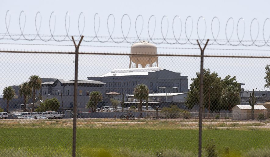 A Wednesday, July 23, 2014, file photo shows the Florence State Prison in Florence, Ariz. Most of Arizona's 15 counties say their jails wouldn't be able to accommodate state inmates who'd no longer be housed at an aging state prison in Florence that Gov. Doug Ducey wants to close. (AP Photo/Ross D. Franklin, File)