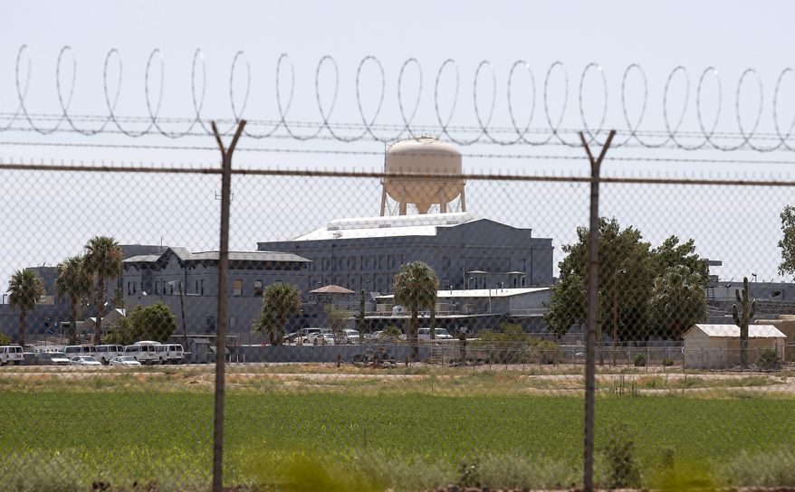 A Wednesday, July 23, 2014, file photo shows the Florence State Prison in Florence, Ariz. Most of Arizona's 15 counties say their jails wouldn't be able to accommodate state inmates who'd no longer be housed at an aging state prison in Florence that Gov. Doug Ducey wants to close. (AP Photo/Ross D. Franklin, File)