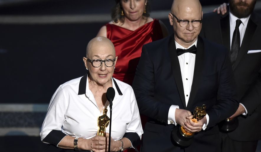 Julia Reichert, left, and Steven Bognar accept the award for best documentary feature for &quot;American Factory&quot; at the Oscars on Sunday, Feb. 9, 2020, at the Dolby Theatre in Los Angeles. (AP Photo/Chris Pizzello)
