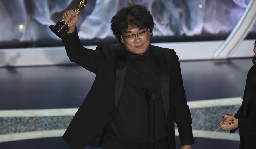 Bong Joon Ho accepts the award for best international feature film for "Parasite," from South Korea, at the Oscars on Sunday, Feb. 9, 2020, at the Dolby Theatre in Los Angeles. (AP Photo/Chris Pizzello)