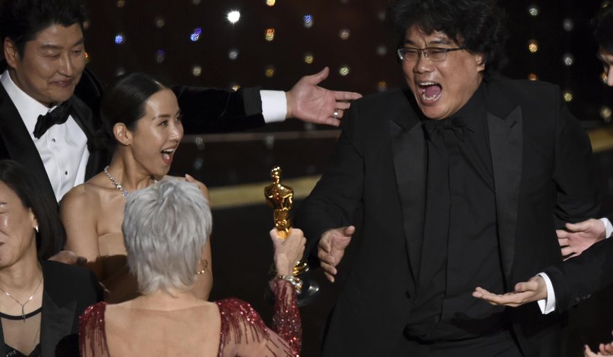 Bong Joon Ho, right, reacts as he is presented with the award for best picture for "Parasite" from presenter Jane Fonda at the Oscars on Sunday, Feb. 9, 2020, at the Dolby Theatre in Los Angeles. Looking on from left are Kang-Ho Song and Kwak Sin Ae.(AP Photo/Chris Pizzello)
