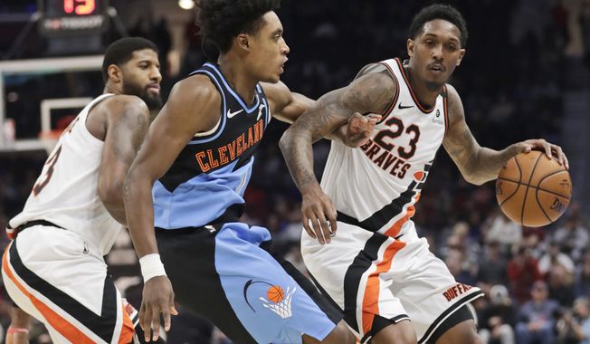 Los Angeles Clippers&#x27; Lou Williams (23) drives past Cleveland Cavaliers&#x27; Collin Sexton (2) in the second half of an NBA basketball game, Sunday, Feb. 9, 2020, in Cleveland. The Clippers won 133-92. (AP Photo/Tony Dejak)
