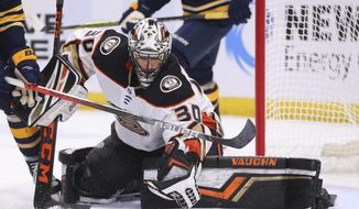 Anaheim Ducks goalie Ryan Miller (30) makes a glove save during the third period of an NHL hockey game against the Buffalo Sabres, Sunday, Feb. 9, 2020, in Buffalo, N.Y. (AP Photo/Jeffrey T. Barnes)