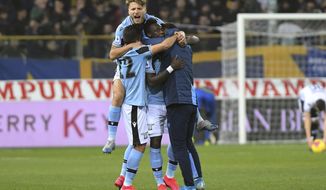 Lazio&#39;s Felipe Caicedo, center, celebrates with Ciro Immobile, top, and other teammates after scoring his side&#39;s first goal during the Italian Serie A soccer match between Parma and Lazio at the Tardini stadium in Parma, Italy, Sunday, Feb. 9, 2020 (Claudio Grassi/LaPresse via AP)