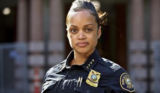 FILE - In this Aug. 5, 2019, file photo, Portland Police Chief Danielle Outlaw poses for a photo in Portland, Ore. Outlaw was named Philadelphia&#39;s new police commissioner and will start work on Monday, Feb. 10, 2020. (AP Photo/Craig Mitchelldyer, File)