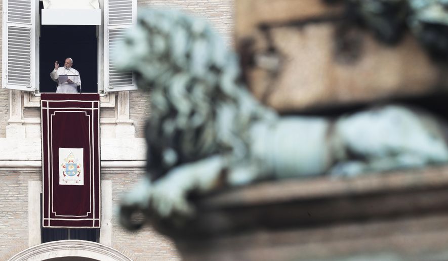 Pope Francis delivers a blessing during the Angelus noon prayer in St. Peter's Square at the Vatican, Sunday, Feb. 9, 2020. (AP Photo/Gregorio Borgia)