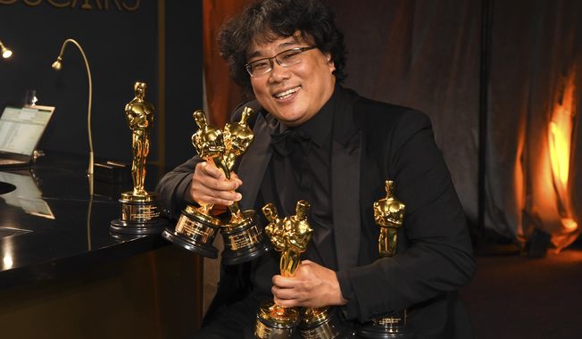 Bong Joon-ho holds the Oscars for best original screenplay, best international feature film, best directing, and best picture for &amp;quot;Parasite&amp;quot; at the Governors Ball after the Oscars on Sunday, Feb. 9, 2020, at the Dolby Theatre in Los Angeles. (Photo by Richard Shotwell/Invision/AP)