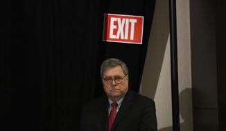 Attorney General William Barr waits as he is introduced to speak at the National Sheriffs&#39; Association Winter Legislative and Technology Conference in Washington, Monday, Feb. 10, 2020. (AP Photo/Susan Walsh)