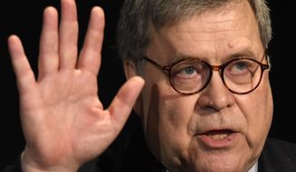 Attorney General William Barr waves after speaking at the National Sheriffs&#39; Association Winter Legislative and Technology Conference in Washington, Monday, Feb. 10, 2020. (AP Photo/Susan Walsh)