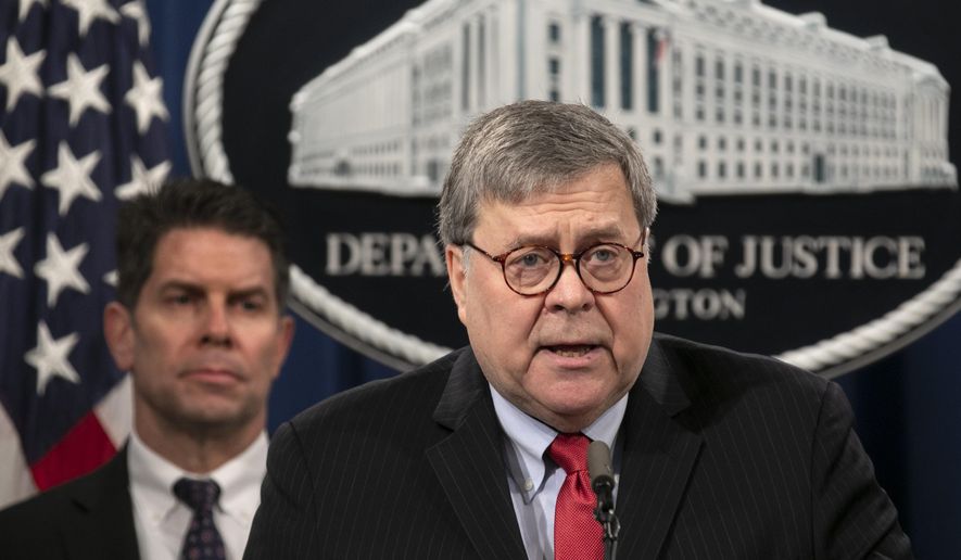 Attorney General William Barr, right, next to FBI Deputy Director David Bowdich, speaks during a news conference, Monday, Feb. 10, 2020, at the Justice Department in Washington.  Four members of the Chinese military have been charged with breaking into the networks of the Equifax credit reporting agency and stealing the personal information of tens of millions of Americans, the Justice Department said Monday, blaming Beijing for one of the largest hacks in history.   (AP Photo/Jacquelyn Martin)