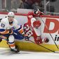 Washington Capitals center Nic Dowd (26) collides into the boards next to New York Islanders center Casey Cizikas (53) during the first period of an NHL hockey game, Monday, Feb. 10, 2020, in Washington. (AP Photo/Nick Wass) ** FILE **