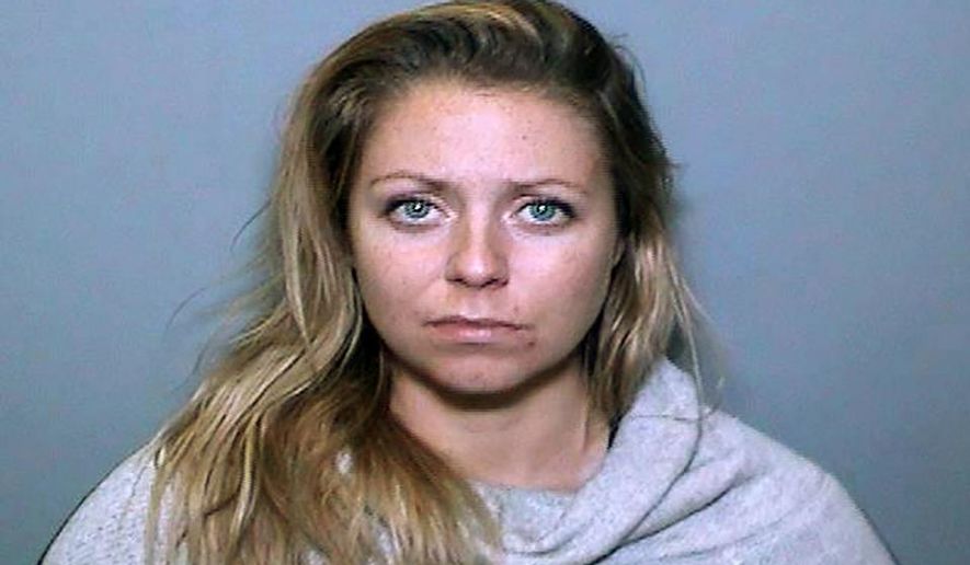 This undated booking photo provided by the Orange County District Attorney's Office shows Amber Angelovic. Prosecutors have dismissed a murder charge against Angelovic, who investigators said was assaulted by the man she fatally stabbed in Southern California three years ago, according to a newspaper report Tuesday, Feb. 11, 2020. (Orange County District Attorney's Office via AP)