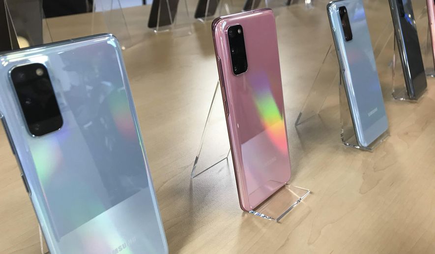 This Friday, Feb. 7, 2020, photo shows the S20 series of phones, the South Korean tech company’s latest flagship smartphone, on display in London during a preview for reporters ahead of the official launch on Tuesday, Feb. 11. (AP Photo/Kelvin Chan)
