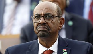 In this July 9, 2018, file photo, Sudan&#39;s President Omar al-Bashir attends a ceremony for Turkey&#39;s President Recep Tayyip Erdogan, at the Presidential Palace in Ankara, Turkey. A top Sudanese official said Monday, Feb. 11, 2020, that transitional authorities and rebel groups have agreed to hand over al-Bashir to the International Criminal Court for war crimes, including mass killings in Darfur. Since his ouster in April, al-Bashir has been in jail in Sudan’s capital, Khartoum over charges corruption and killing protesters. (AP Photo/Burhan Ozbilici, File)