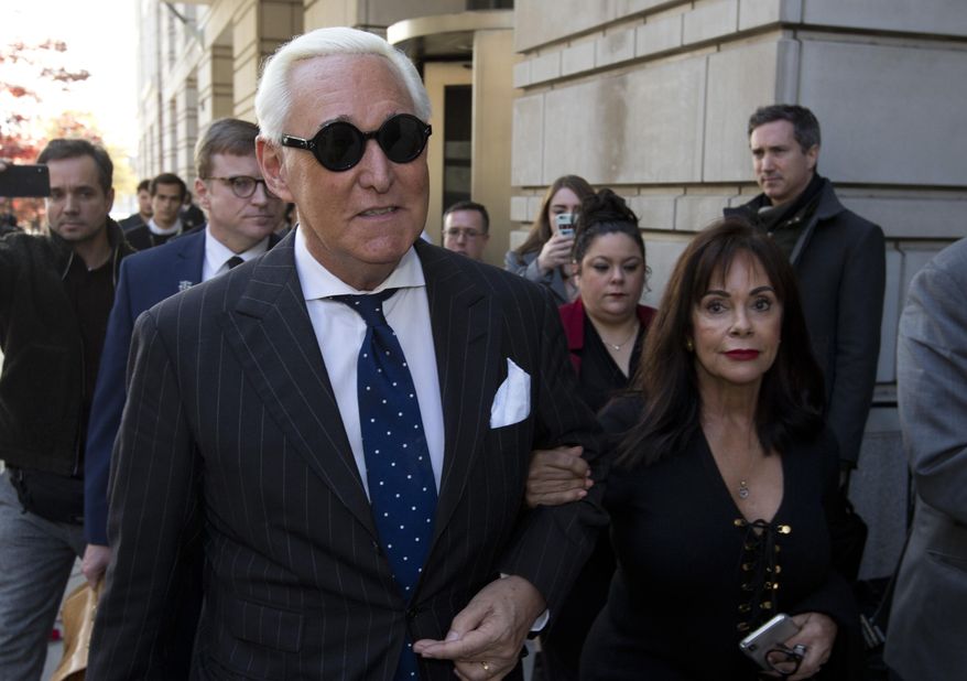 Roger Stone (left), with his wife Nydia Stone, leaves federal court in Washington on Friday, Nov. 15, 2019. (AP Photo/Jose Luis Magana) **FILE**