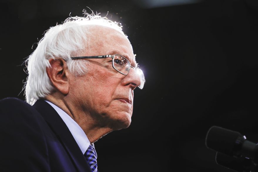 Democratic presidential candidate Sen. Bernie Sanders, I-Vt., speaks to supporters at a primary night election rally in Manchester, N.H., Tuesday, Feb. 11, 2020. (AP Photo/Matt Rourke)
