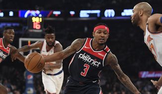 Washington Wizards guard Bradley Beal (3) dribbles the ball as New York Knicks center Taj Gibson (67) defends during the first half of an NBA basketball game, Wednesday, Feb. 12, 2020, in New York. (AP Photo/Sarah Stier)