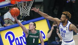 FILE - In this Dec. 20, 2019, file photo, Binghamton&#39;s Hakon Hjalmarsson (1), of Iceland, shoots as Pittsburgh&#39;s Terrell Brown (21) defends during the second half of an NCAA college basketball game in Pittsburgh. Hjalmarsson is just starting his American basketball experience and trying to find his role at Binghamton. (AP Photo/Keith Srakocic, File)