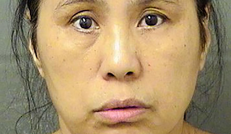 This Wednesday, Dec. 18, 2019, file booking photo provided by the Palm Beach County Sheriff's Office, in Fla., shows Jing Lu. (Palm Beach County Sheriff's Office via AP, File)