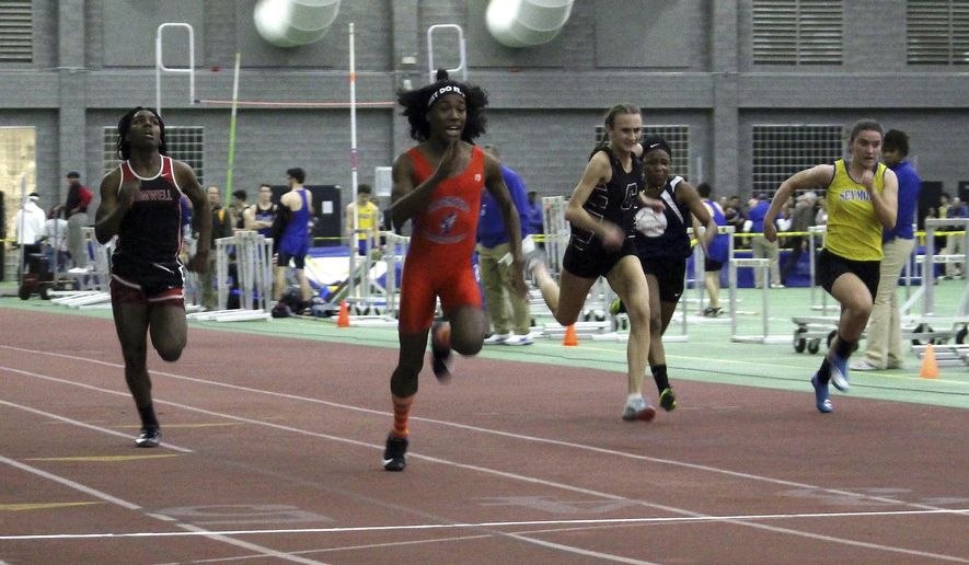 In this Feb. 7, 2019, file photo, Bloomfield High School transgender athlete Terry Miller, second from left, wins the final of the 55-meter dash over transgender athlete Andraya Yearwood, far left, and other runners in the Connecticut girls Class S indoor track meet at Hillhouse High School in New Haven, Conn. Miller and Yearwood are among Connecticut transgender athletes who would be blocked from participating in girls sports under a federal lawsuit filed Wednesday, Feb. 12, 2020, by the families of three athletes. (AP Photo/Pat Eaton-Robb, File)