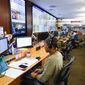 Personnel at the The Centers for Disease Control and Prevention (CDC) work the Emergency Operations Center in response to the 2019 Novel Coronavirus, among other things, Thursday, Feb. 13, 2020, in Atlanta. (AP Photo/John Amis)