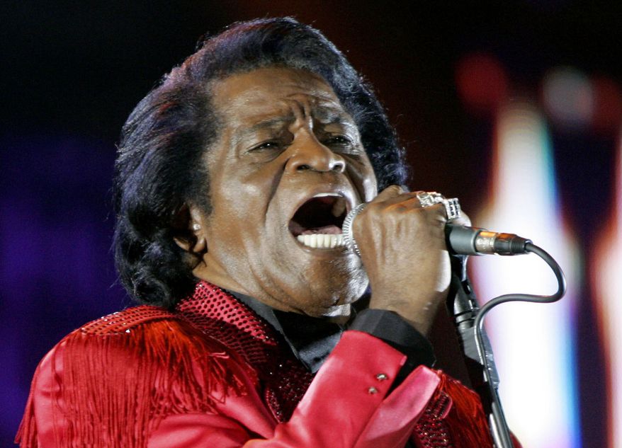 FILE - In this July 6, 2005 file photo, James Brown performs on stage during the Live 8 concert at Murrayfield Stadium in Edinburgh, Scotland. A prosecutor in Atlanta will decide whether to open a formal investigation after meeting with a woman who says she has evidence the legendary singer's death was caused by another person, his spokesman said. Brown, known as the Godfather of Soul, was 73 when he died of heart failure on Christmas day in 2006 in Atlanta, less than two days after being hospitalized for treatment of pneumonia. (AP Photo/Matt Dunham, File)