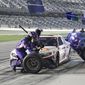 Denny Hamlin comes in for a pit stop during the first of two NASCAR Daytona 500 qualifying auto races at Daytona International Speedway, Thursday, Feb. 13, 2020, in Daytona Beach, Fla. (AP Photo/Terry Renna)