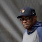 Houston Astros manager Dusty Baker leans against at fence during spring training baseball practice Thursday, Feb. 13, 2020, in West Palm Beach, Fla. (AP Photo/Jeff Roberson)