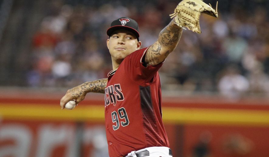 FILE - In this Sept. 29, 2019, file photo, Arizona Diamondbacks' Taijuan Walker throws to a San Diego Padres batter during the first inning of a baseball game in Phoenix. Walker returned to the Seattle Mariners, agreeing Wednesday. Feb. 12, 2020, to a $2 million, one-year contract that includes $500,000 each in performance and roster bonuses. (AP Photo/Darryl Webb, File)