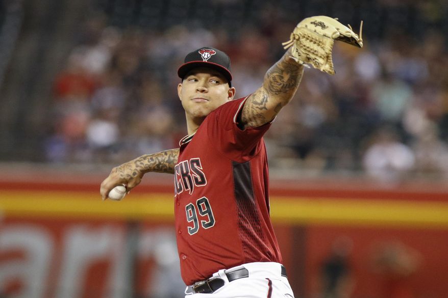 FILE - In this Sept. 29, 2019, file photo, Arizona Diamondbacks' Taijuan Walker throws to a San Diego Padres batter during the first inning of a baseball game in Phoenix. Walker returned to the Seattle Mariners, agreeing Wednesday. Feb. 12, 2020, to a $2 million, one-year contract that includes $500,000 each in performance and roster bonuses. (AP Photo/Darryl Webb, File)