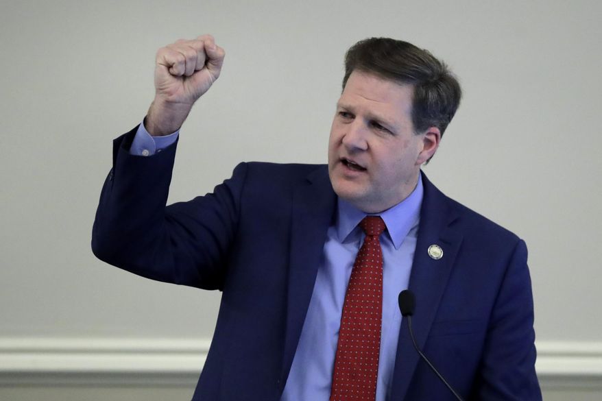 Republican N.H. Gov. Chris Sununu gestures during his State of the State address at the State House in Concord, N.H., Thursday, Feb. 13, 2020. (AP Photo/Charles Krupa) ** FILE **