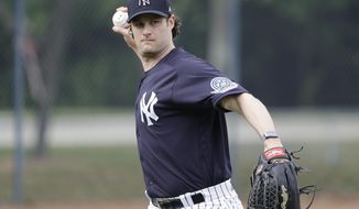 New York Yankees&#39; Gerrit Cole throws to first base during a spring training baseball workout Thursday, Feb. 13, 2020, in Tampa, Fla. (AP Photo/Frank Franklin II)