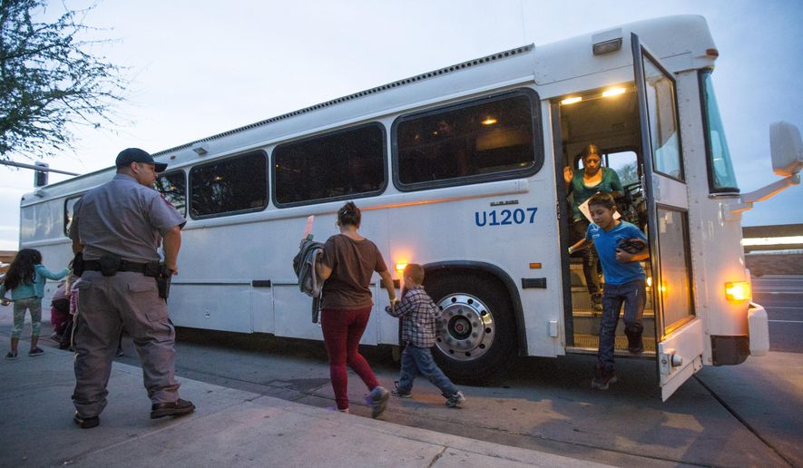 FILE - In this May 28, 2014, file photo, migrants are released from ICE custody at a Greyhound bus station in Phoenix. A Customs and Border Protection memo dated Jan. 28, 2020, obtained by The Associated Press confirms that bus companies such as Greyhound do not have to allow Border Patrol agents on board to conduct routine checks for illegal immigrants, despite the company&#39;s insistence that it has no choice but to do so. (Michael Chow/The Arizona Republic via AP, File)